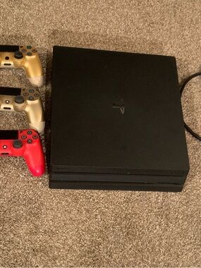 Sony PlayStation 4 Pro 1TB Console with Gold and Red Controllers